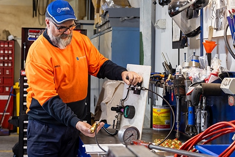 a man testing pressure on an air preparation